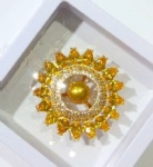 Brass sun shape brooch with clear and yellow CZ stone in gold plating